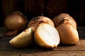 Brown onions on a wooden table