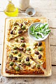 Olive, anchovy and mushroom pizza