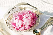 Pink peonies in antique silver dish