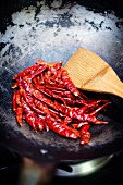 Dried Thai chillis in a wok