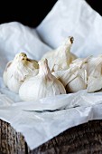 Garlic bulbs on greaseproof paper