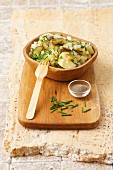 Potato salad with gherkins, onions and chives