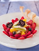 A summer fruit salad with berries