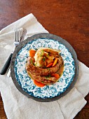 Sausage with cabbage and carots