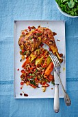 Chicken leg with potatoes, carrots and peppers