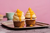 Chocolate cupcakes with mango topping