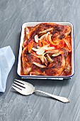 Roast chicken legs with peppers and onions