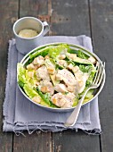 Caesar salad with avocado, grilled chicken and croutons