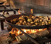 Paella on open fire stove