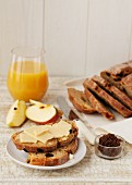 Raisin bread with cheese, apples, fig paste and fruit juice