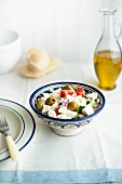 Greek salad with olive oil and pita bread