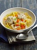 Jewish chicken soup with vegetables, pasta and matze dumplings