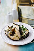 Sturgeon steaks with capers