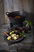 Fondue with game, Brussels sprouts, leek and a cranberry dip