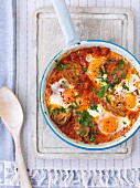 Poached eggs in a tomato and vegetable sauce