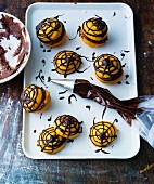 Halloween whoopie pies decorated with chocolate spider webs