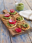 Savoury waffle canapes with herb cream and radishes