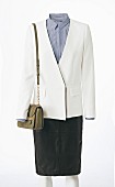 A white blazer with a stripped blouse underneath it, a handbag and a black A-Line skirt