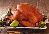 Roast turkey with fruits and herbs