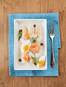 White asparagus with smoked salmon, boiled egg, caper mayonnaise and dill