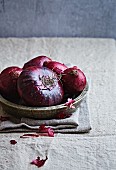 Red onions in a rustic dish