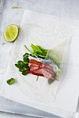 Rice paper rolls with duck breast and vegetables being made