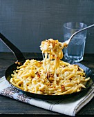 Käsespätzle (soft egg noodles from Swabia with cheese) with crispy onions