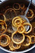 Onion rings being fried