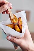 Potato wedges in a paper cone