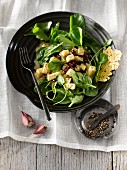 A winter salad with celeriac, spinach, dried cranberries, Parmesan crisps and a Dijon mustard dressing