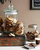 Cantucci with almonds, with pistachios or with hazelnuts in storage jars