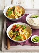 Spicy butternut squash curry with prawns, coconut milk, chilli peppers and rice (Asia)