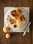 Grilled peach and apricot halves with honeycomb