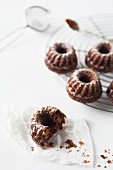 Bundt cakes on a wire rack and in front of it