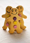 Gingerbread men decorated with colourful chocolate beans