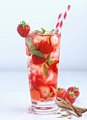 Iced tea with strawberries and cinnamon sticks