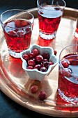 Glasses of cranberry juice on a tray