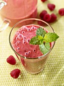 A yoghurt and raspberry shake with mint