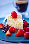 A slice of cheesecake with mixed berries