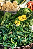 A basket of spinach at a market