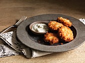 Crispy fish cakes with a dip