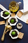 Tapenade with basil, olive oil, salt and crackers