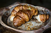 Croissant in a wooden bowl