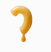 A question mark made from a piece of pasta with dripping cheese sauce