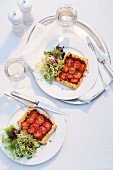 Quick tomato tarts served with a mixed leaf salad