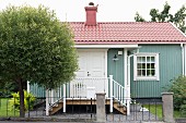 Small, Swedish country house with veranda and lattice windows