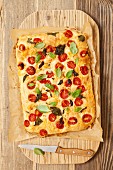 Focaccia with cherry tomatoes, goat's cheese and basil