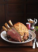 Roast beef for Christmas dinner with a mustard crust and onion gravy
