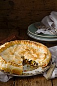 Courgette, pepper and feta cheese puff pastry pie, sliced