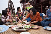 Women eating together, Thailand
